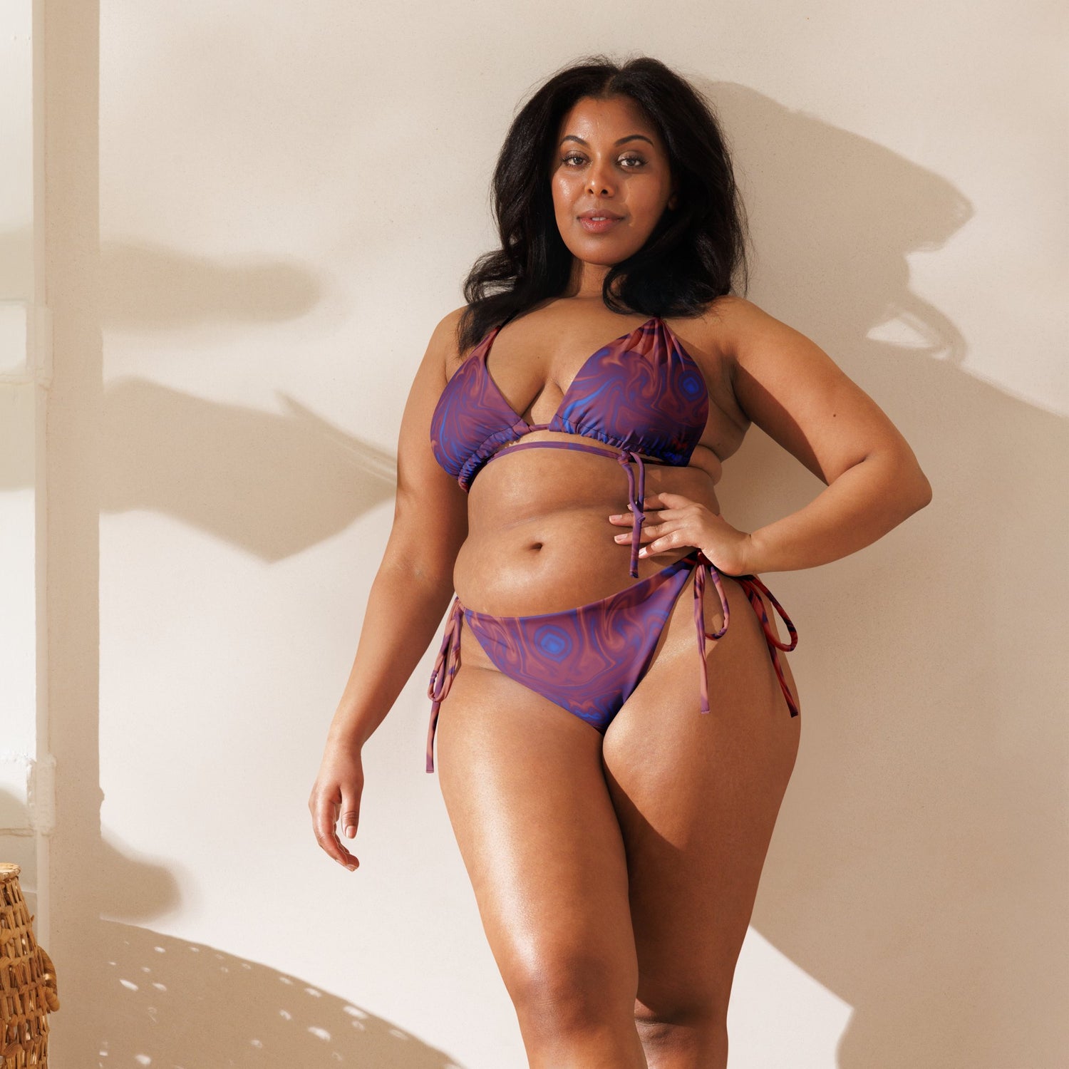 Plus size model wearing blue swirl string bikini from lillielux.com