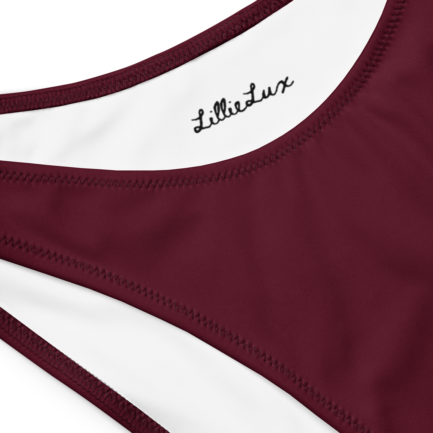 Detail of merlot bikini fabric and Lillie Lux logo close-up
