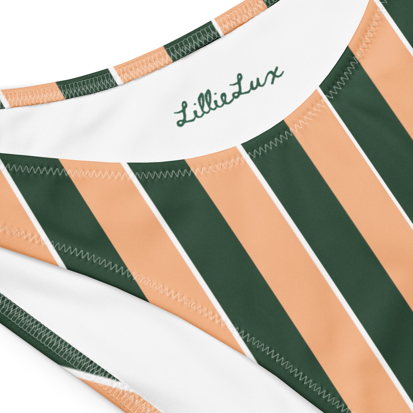 Close-up of Lillie Lux logo on Sunset Stadium striped bikini top – eco swimwear