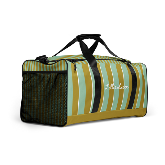 Side profile of Palm Tonic Duffle Bag with mesh side pocket and tonal striping LillieLux.com