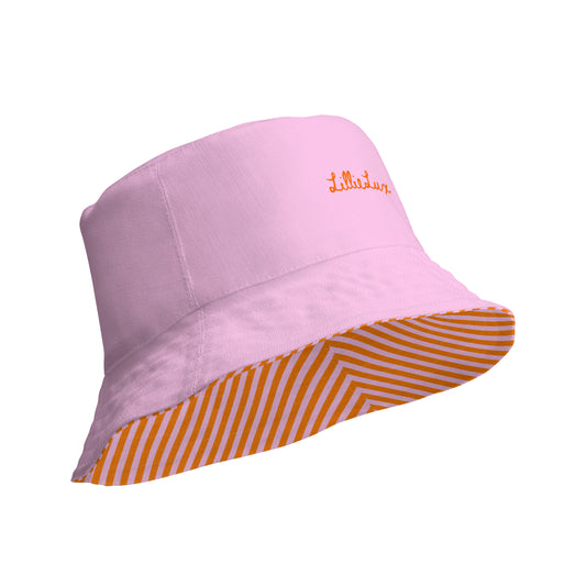 Light pastel pink side of reversible bucket hat, orange logo detail, by LillieLux.